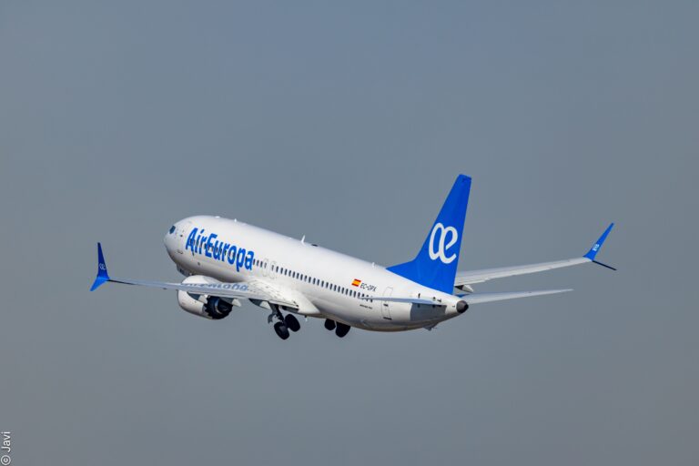 Air Europa Boeing aircraft flying in the sky with blue logo and tail fin.